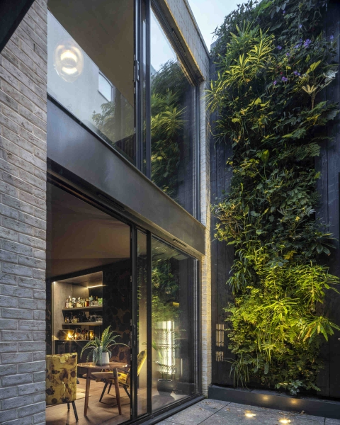 The London House with a Secret Basement, Double-Height Courtyard and Green Wall