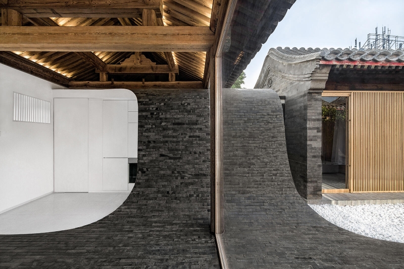 This Home's Courtyard Curves Through The Roof, Floor, and Walls