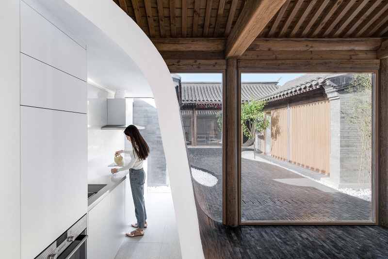 This Home's Courtyard Curves Through The Roof, Floor, and Walls
