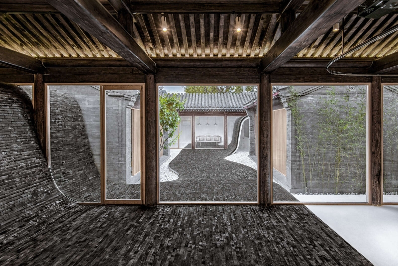 This Home's Courtyard Curves Through The Roof, Floor, and Walls
