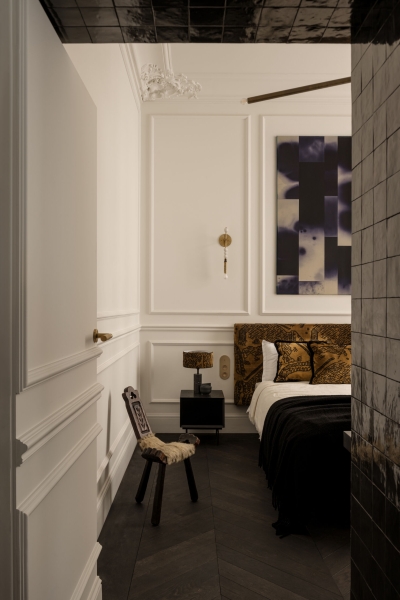 This small apartment feels twice the size, because the bathroom hides in a mirrored box