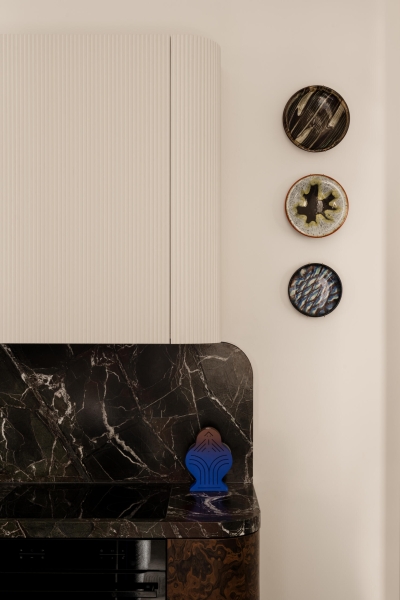 This small apartment feels twice the size, because the bathroom hides in a mirrored box