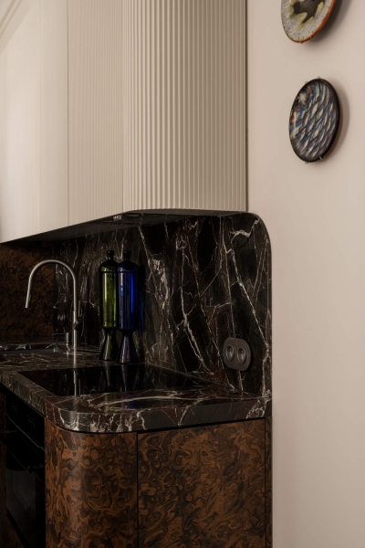 This small apartment feels twice the size, because the bathroom hides in a mirrored box