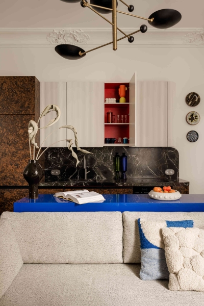 This small apartment feels twice the size, because the bathroom hides in a mirrored box