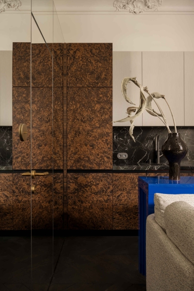 This small apartment feels twice the size, because the bathroom hides in a mirrored box