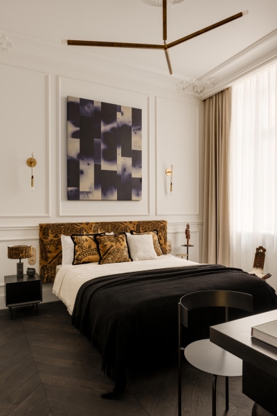 This small apartment feels twice the size, because the bathroom hides in a mirrored box