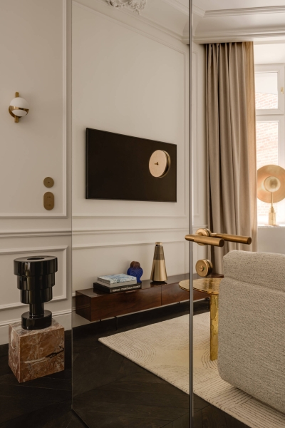 This small apartment feels twice the size, because the bathroom hides in a mirrored box