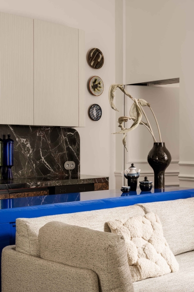 This small apartment feels twice the size, because the bathroom hides in a mirrored box