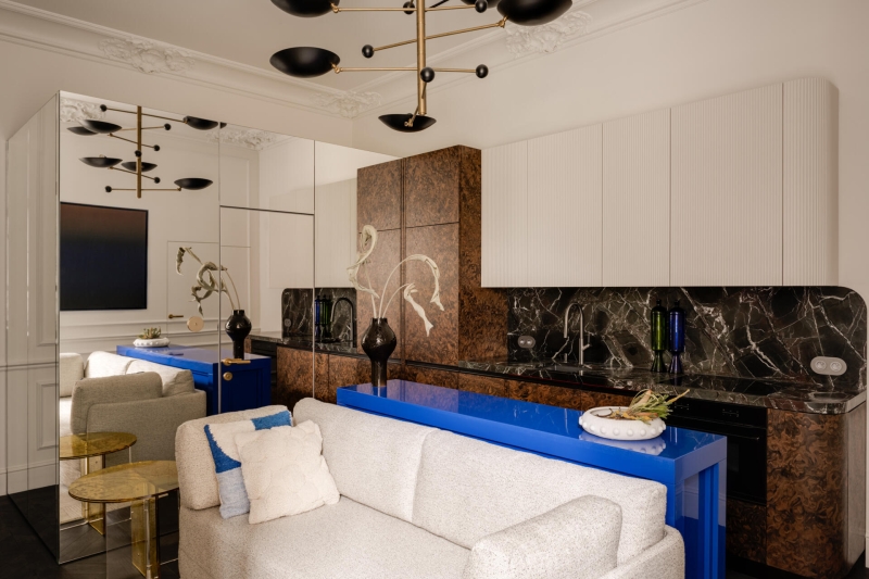 This small apartment feels twice the size, because the bathroom hides in a mirrored box