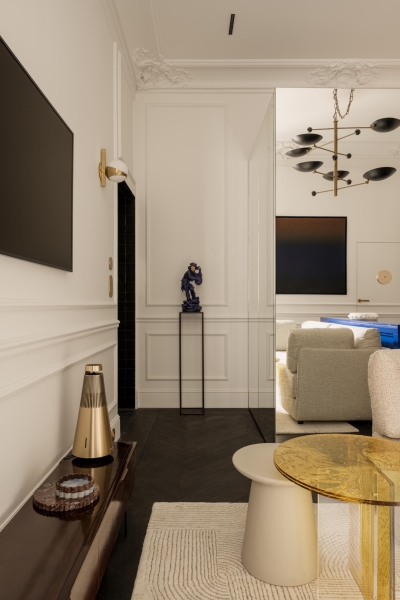 This small apartment feels twice the size, because the bathroom hides in a mirrored box