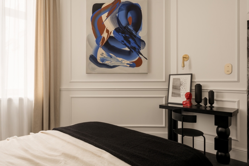 This small apartment feels twice the size, because the bathroom hides in a mirrored box