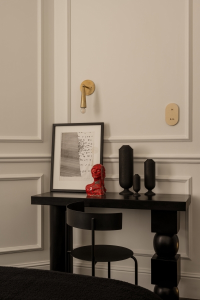 This small apartment feels twice the size, because the bathroom hides in a mirrored box