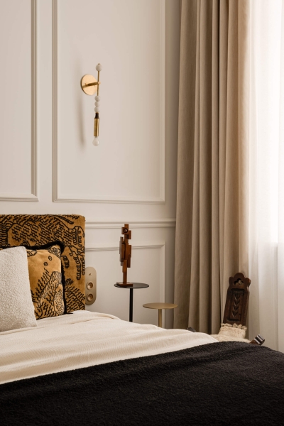 This small apartment feels twice the size, because the bathroom hides in a mirrored box