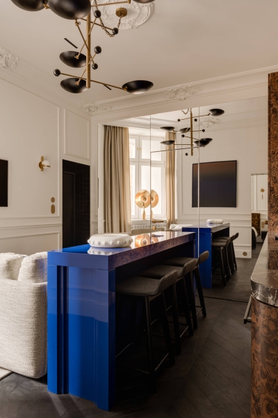 This small apartment feels twice the size, because the bathroom hides in a mirrored box