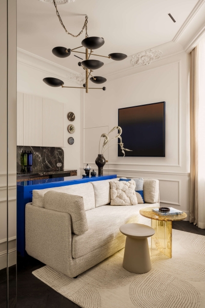 This small apartment feels twice the size, because the bathroom hides in a mirrored box