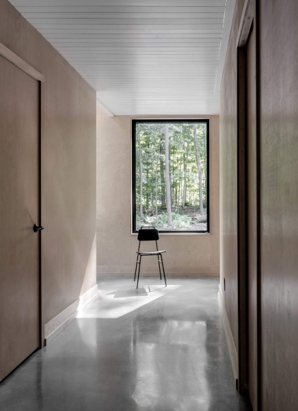 Why This Moody Black Cottage in the Canadian Woods Feels So Peaceful Inside