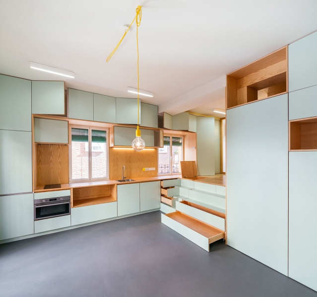 A Pocket Sized Home with a Raised Bedroom and Plenty of Storage