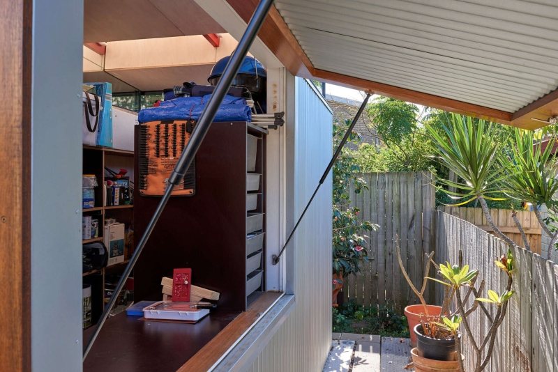 Take a Look at a Small Backyard Studio with a Living Space, Bathroom, and Workspace