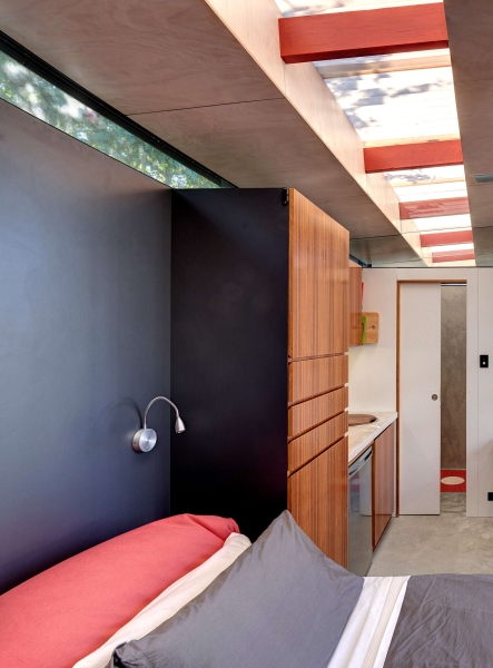 Take a Look at a Small Backyard Studio with a Living Space, Bathroom, and Workspace