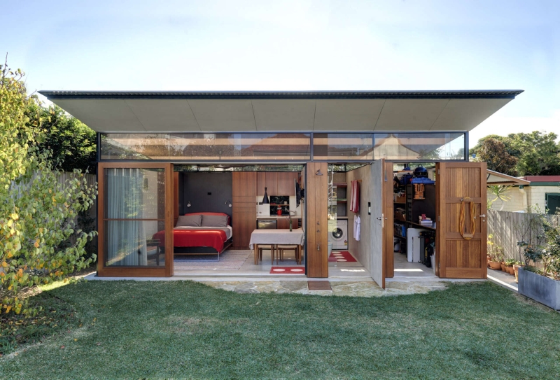 Take a Look at a Small Backyard Studio with a Living Space, Bathroom, and Workspace