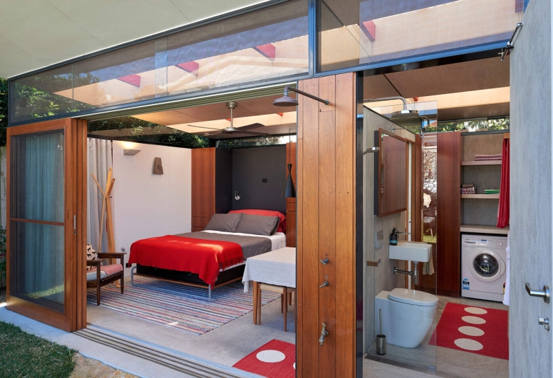 Take a Look at a Small Backyard Studio with a Living Space, Bathroom, and Workspace