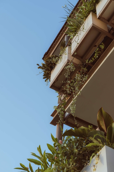 Terrace Living and a Cantilevered Pool in a Hillside Home