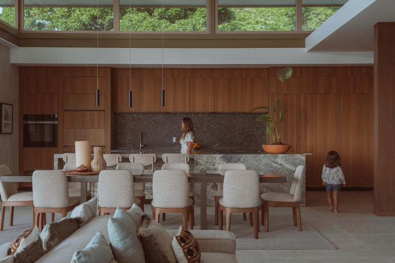 Terrace Living and a Cantilevered Pool in a Hillside Home