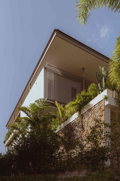 Terrace Living and a Cantilevered Pool in a Hillside Home