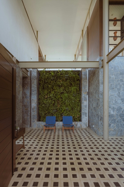 Terrace Living and a Cantilevered Pool in a Hillside Home