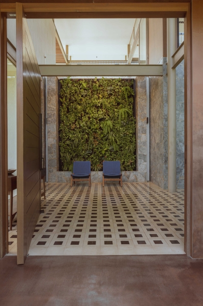 Terrace Living and a Cantilevered Pool in a Hillside Home