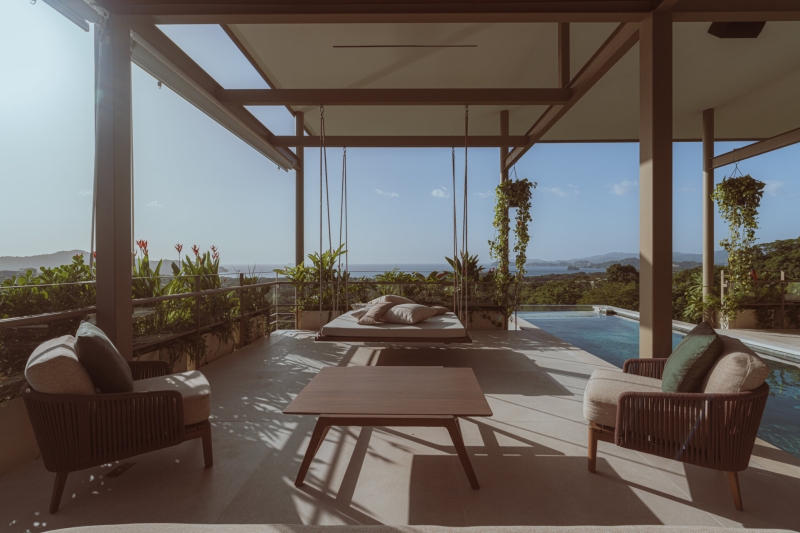 Terrace Living and a Cantilevered Pool in a Hillside Home