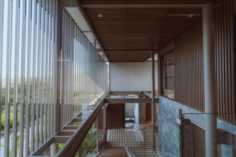 Terrace Living and a Cantilevered Pool in a Hillside Home