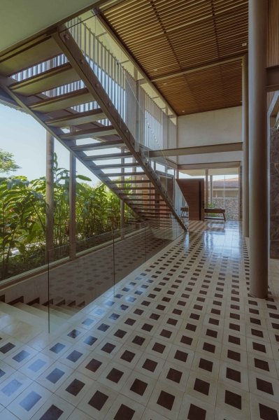 Terrace Living and a Cantilevered Pool in a Hillside Home