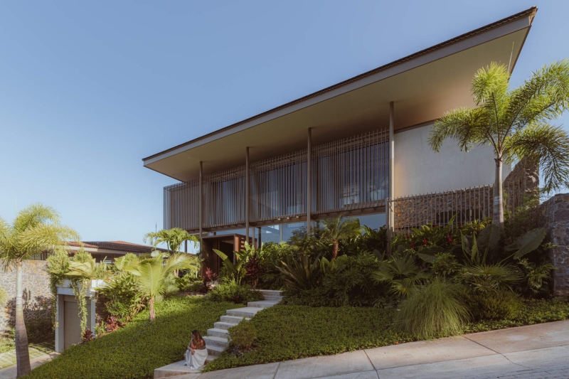 Terrace Living and a Cantilevered Pool in a Hillside Home