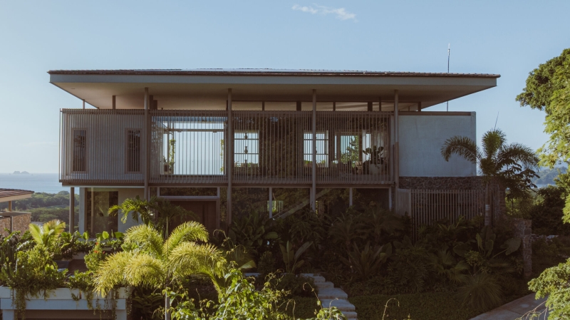 Terrace Living and a Cantilevered Pool in a Hillside Home
