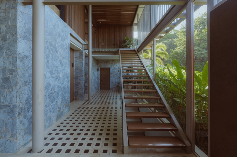 Terrace Living and a Cantilevered Pool in a Hillside Home