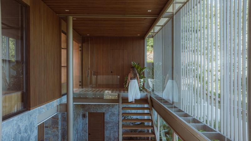 Terrace Living and a Cantilevered Pool in a Hillside Home