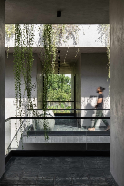 Tour this home that uses Stone Walls and Hanging Greens to Shape Every Space