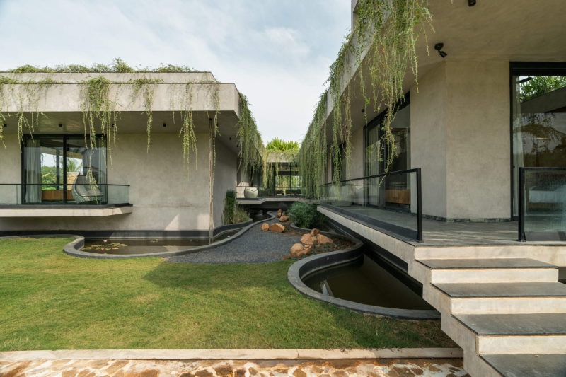 Tour this home that uses Stone Walls and Hanging Greens to Shape Every Space