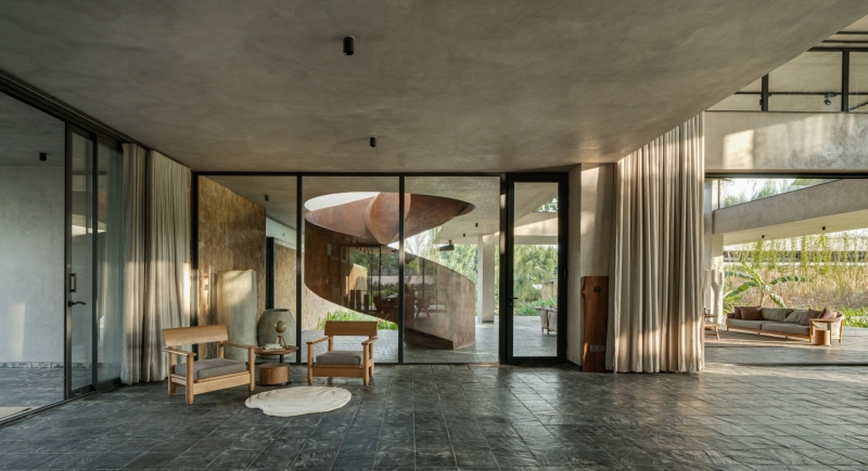 Tour this home that uses Stone Walls and Hanging Greens to Shape Every Space