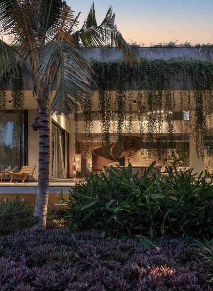 Tour this home that uses Stone Walls and Hanging Greens to Shape Every Space