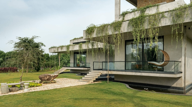 Tour this home that uses Stone Walls and Hanging Greens to Shape Every Space