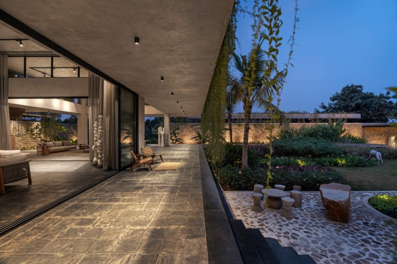 Tour this home that uses Stone Walls and Hanging Greens to Shape Every Space