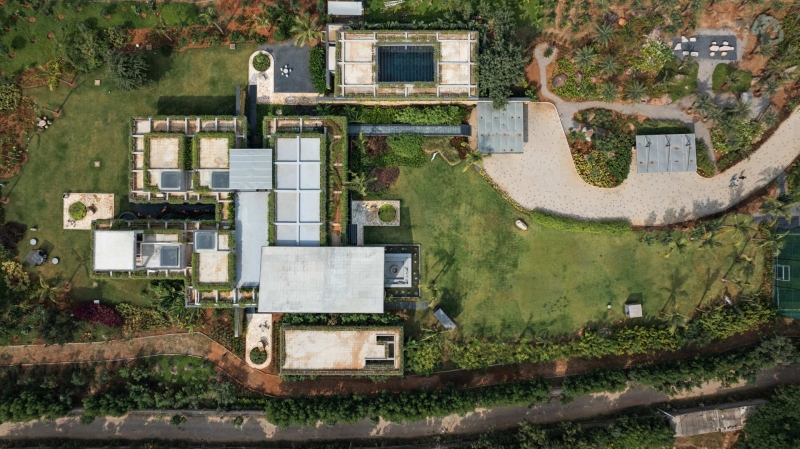 Tour this home that uses Stone Walls and Hanging Greens to Shape Every Space