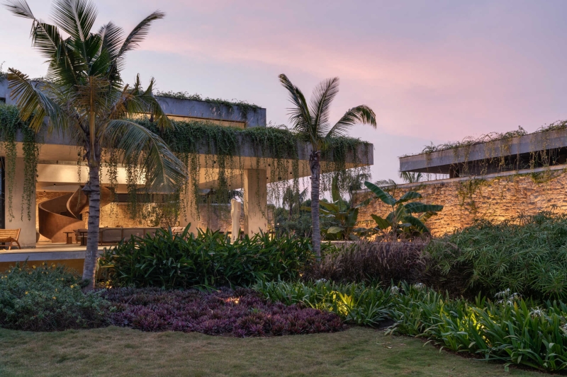 Tour this home that uses Stone Walls and Hanging Greens to Shape Every Space