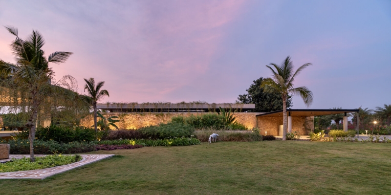 Tour this home that uses Stone Walls and Hanging Greens to Shape Every Space