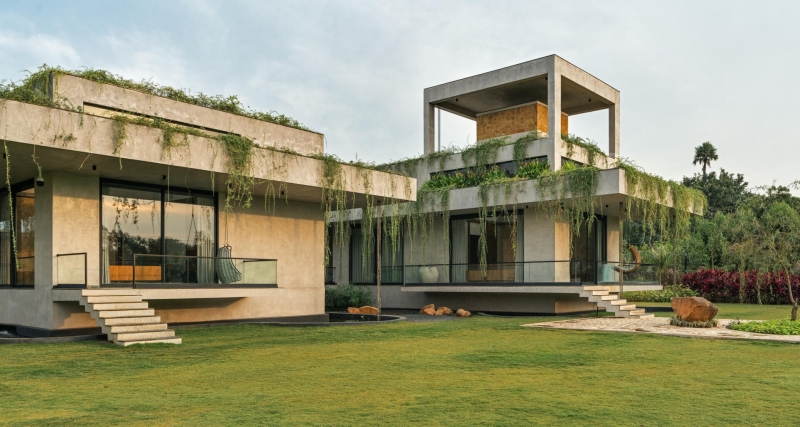 Tour this home that uses Stone Walls and Hanging Greens to Shape Every Space