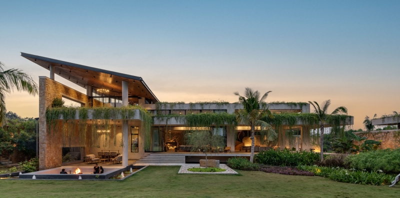 Tour this home that uses Stone Walls and Hanging Greens to Shape Every Space