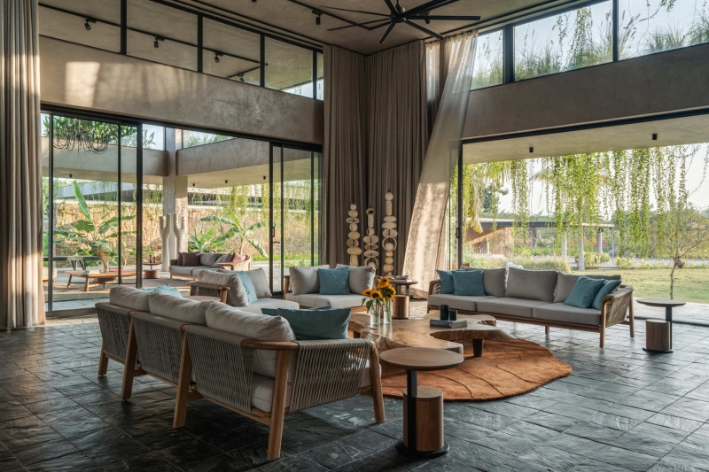 Tour this home that uses Stone Walls and Hanging Greens to Shape Every Space