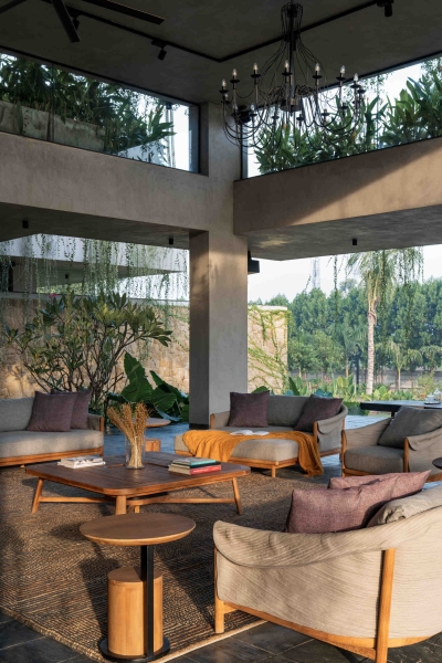 Tour this home that uses Stone Walls and Hanging Greens to Shape Every Space